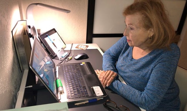 Penny Bankhead at desk with laptop