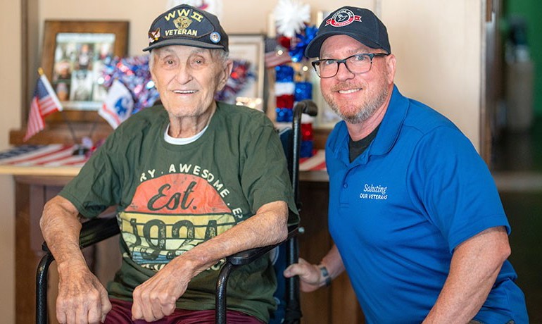 Saluting our Veterans volunteer with a veteran