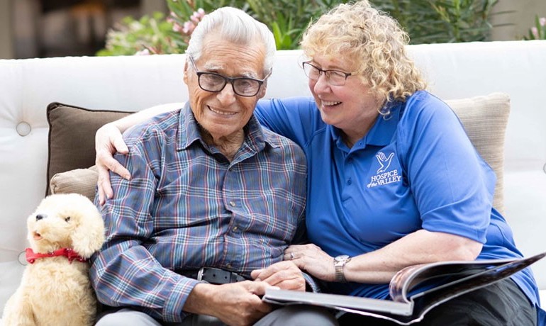 A patient and an HOV staff member smile together