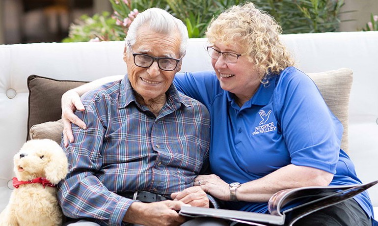Dementia activities coordinator Gail Higginbotham, CNA, with patient Feliciano Ordonez