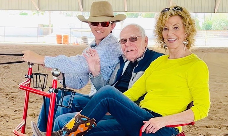 Earl Cooper enjoys a horse buggy ride in the Hunkapi Farms arena