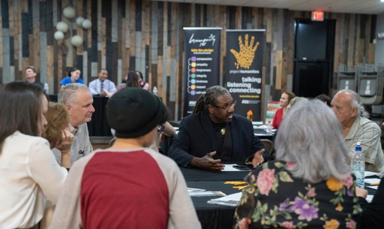 Neal Lester in discussion with a group of attendees
