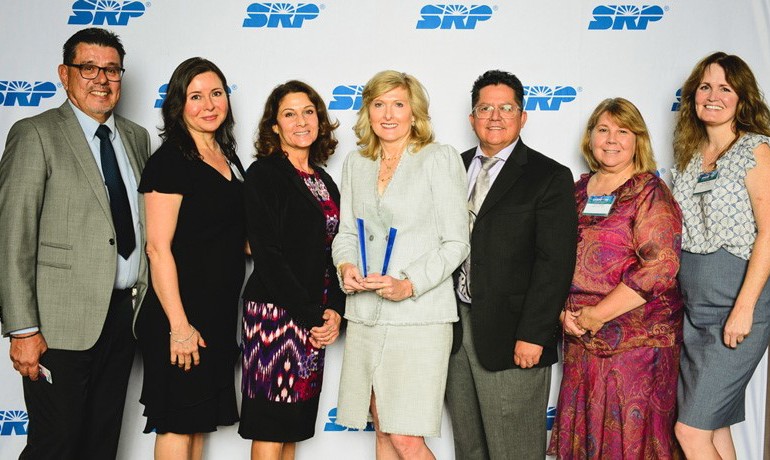 HOV leadership poses with award