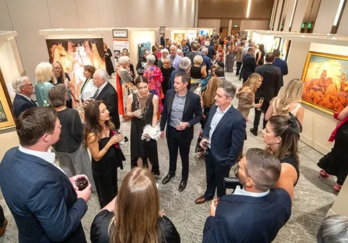People viewing artwork at the aaha event