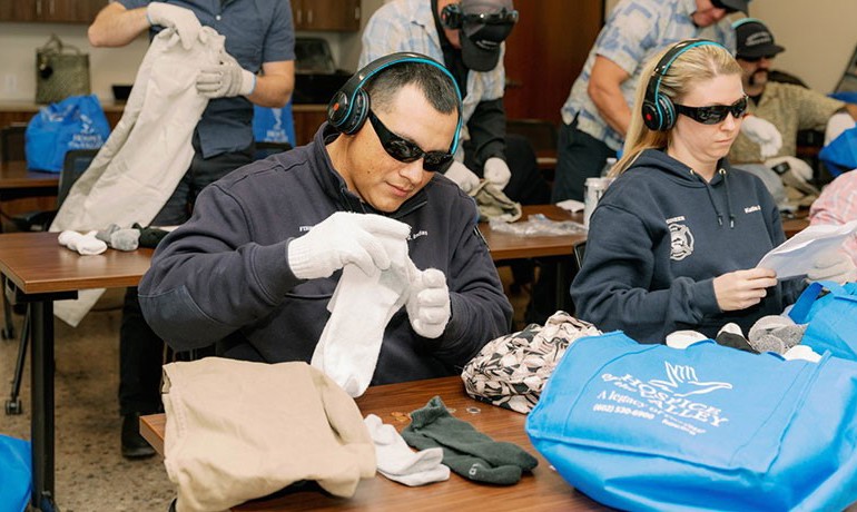 First responders attempt to complete tasks while wearing gear to simulate life with dementia