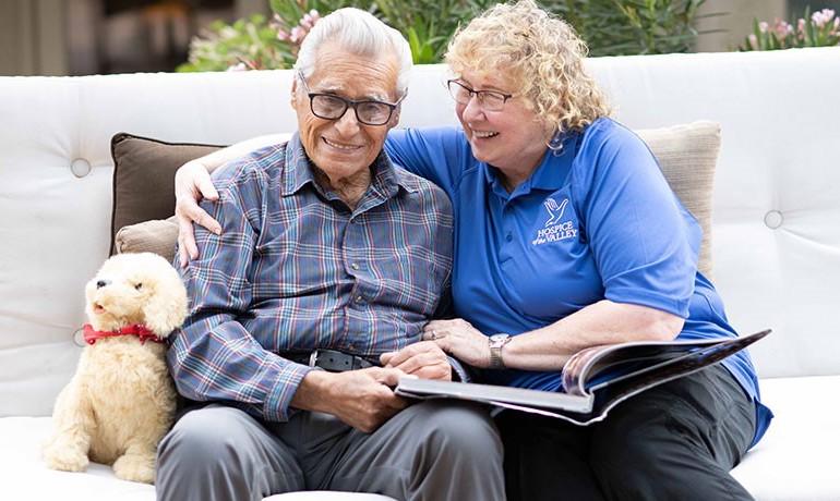 Dementia activities coordinator Gail Higginbotham, CNA, with patient Feliciano Ordonez