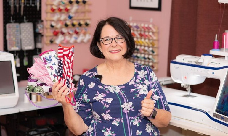 Linda Miller holding a variety of face masks