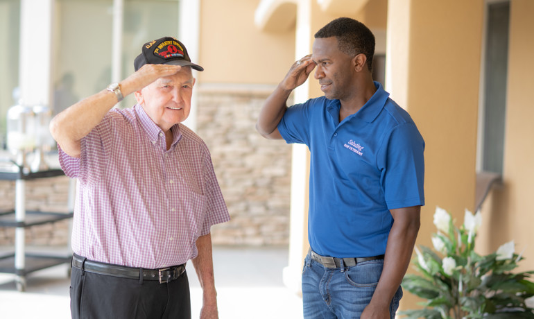 Saluting our Veterans volunteer with a veteran