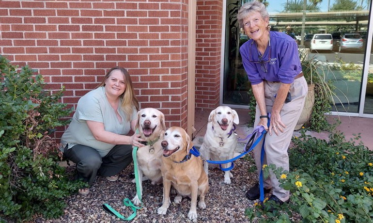 Hospice of the Valley pet therapy program coordinator Carol Keenan and volunteer Marian Wallace with her therapy dogs Richey, Mattie and Harper.