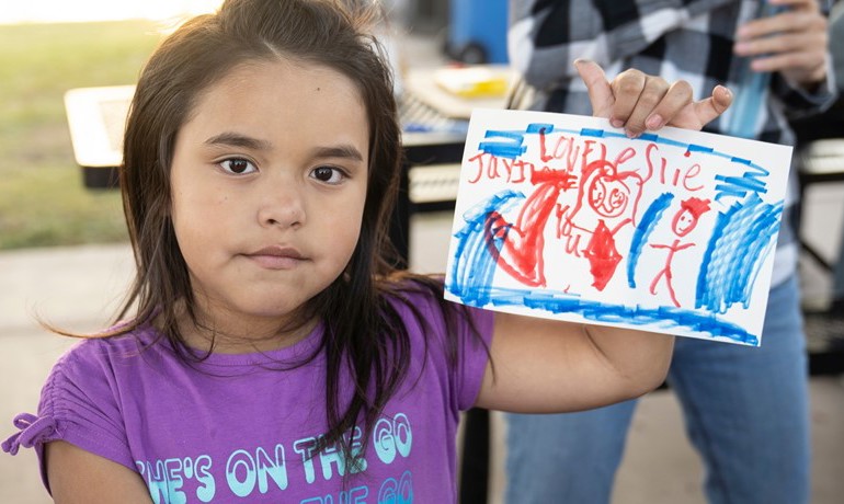 New Song Center child painting at event