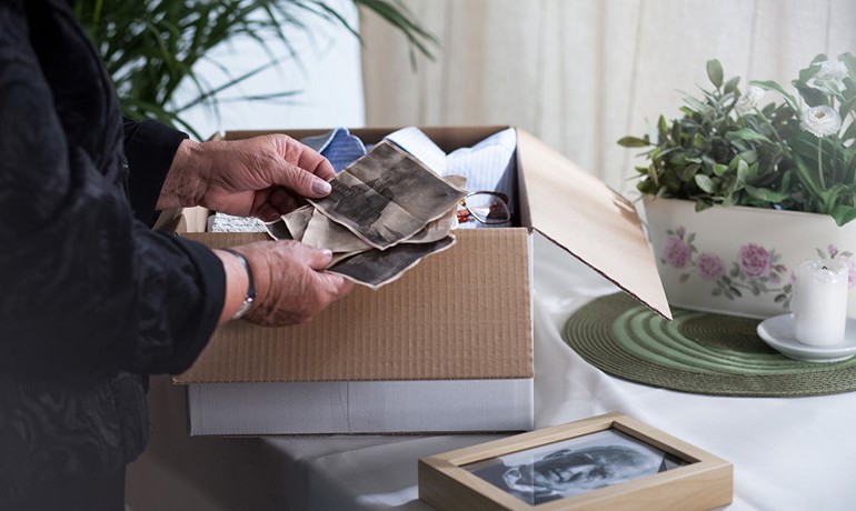 Person sorting through old photos
