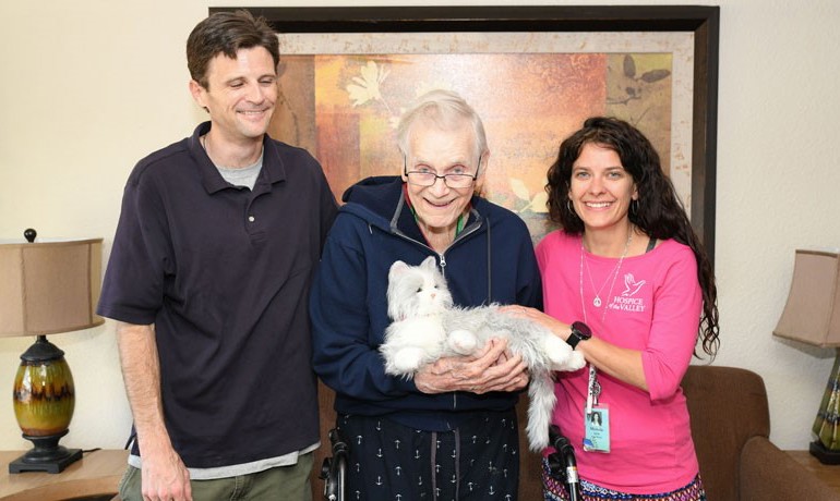 Andrew Gaines, Michelle Bales, and Walter “Wally” Brown with his mechanical cat